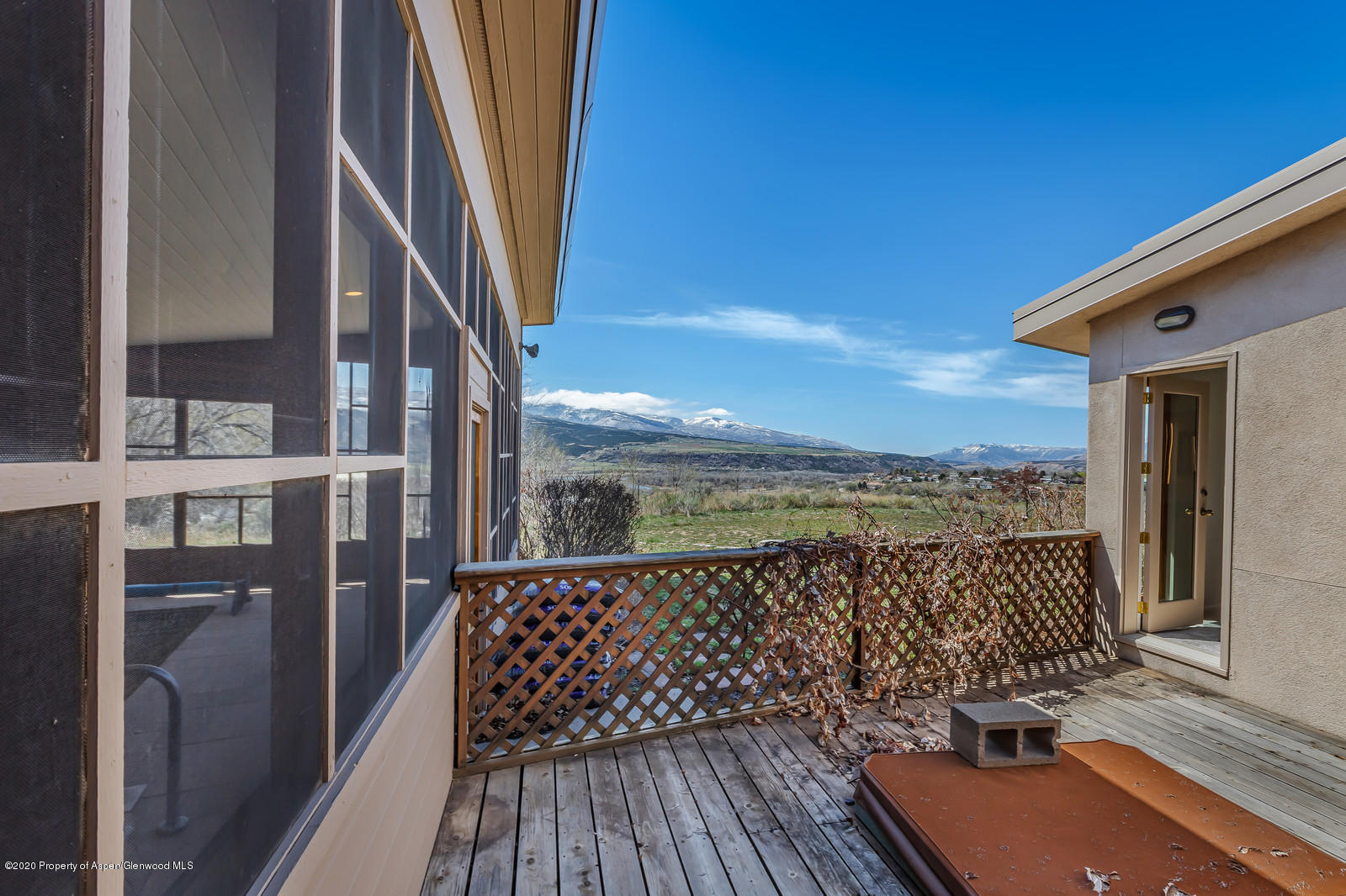 735 Ute Avenue Rifle, CO 81650 - Photo 26 of 30 a view of balcony with floor to ceiling window and wooden floor