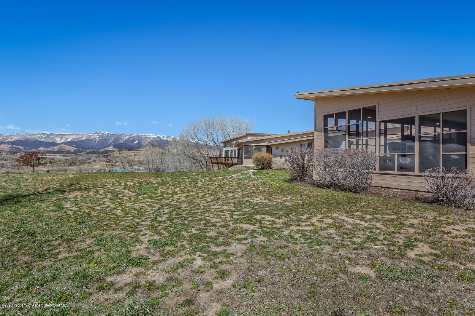 735 Ute Avenue Rifle, CO 81650 - Photo 29 of 30 a view of a house with a yard