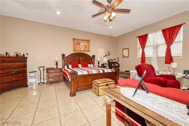 a bed room with a bed and a chandelier