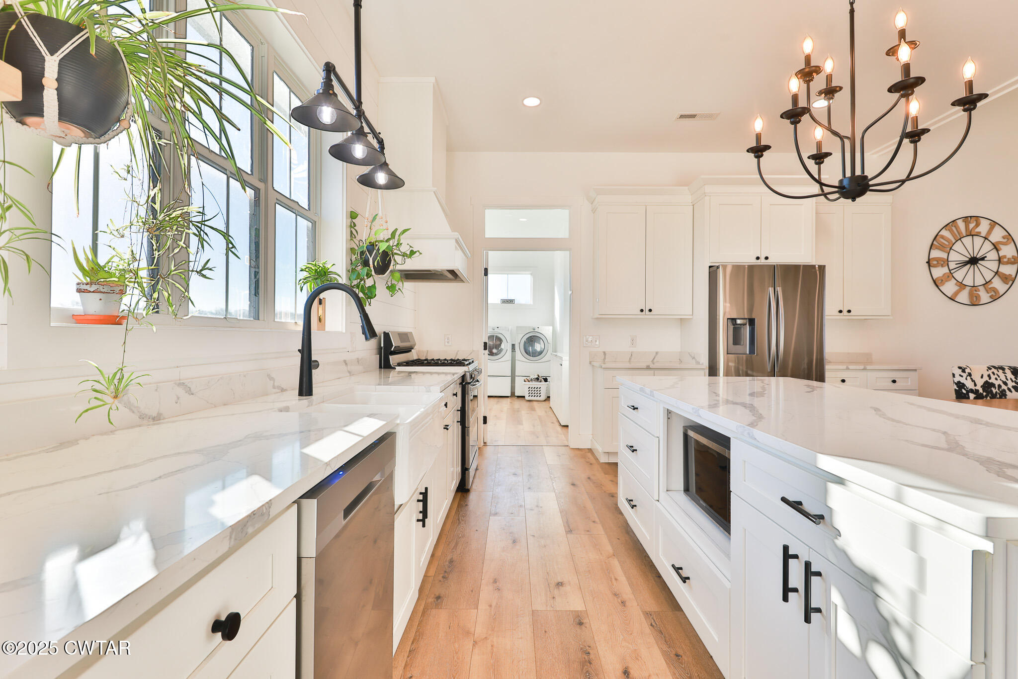 350 Klutts Road Dresden, TN 38225 - Photo 13 of 39 a large white kitchen with a large stove a sink dishwasher and a stove with wooden floor