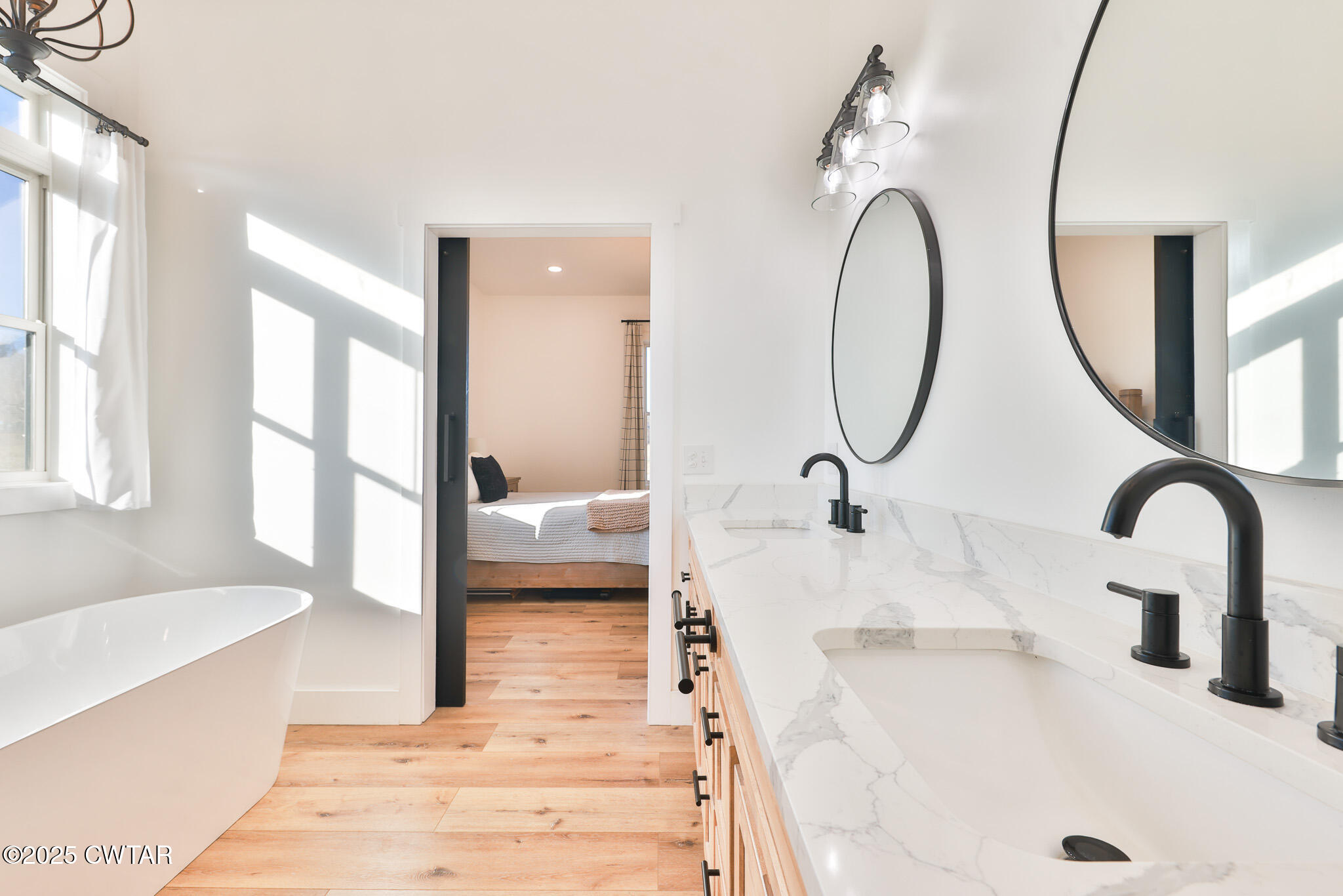350 Klutts Road Dresden, TN 38225 - Photo 19 of 39 a bathroom with a tub sink and mirror