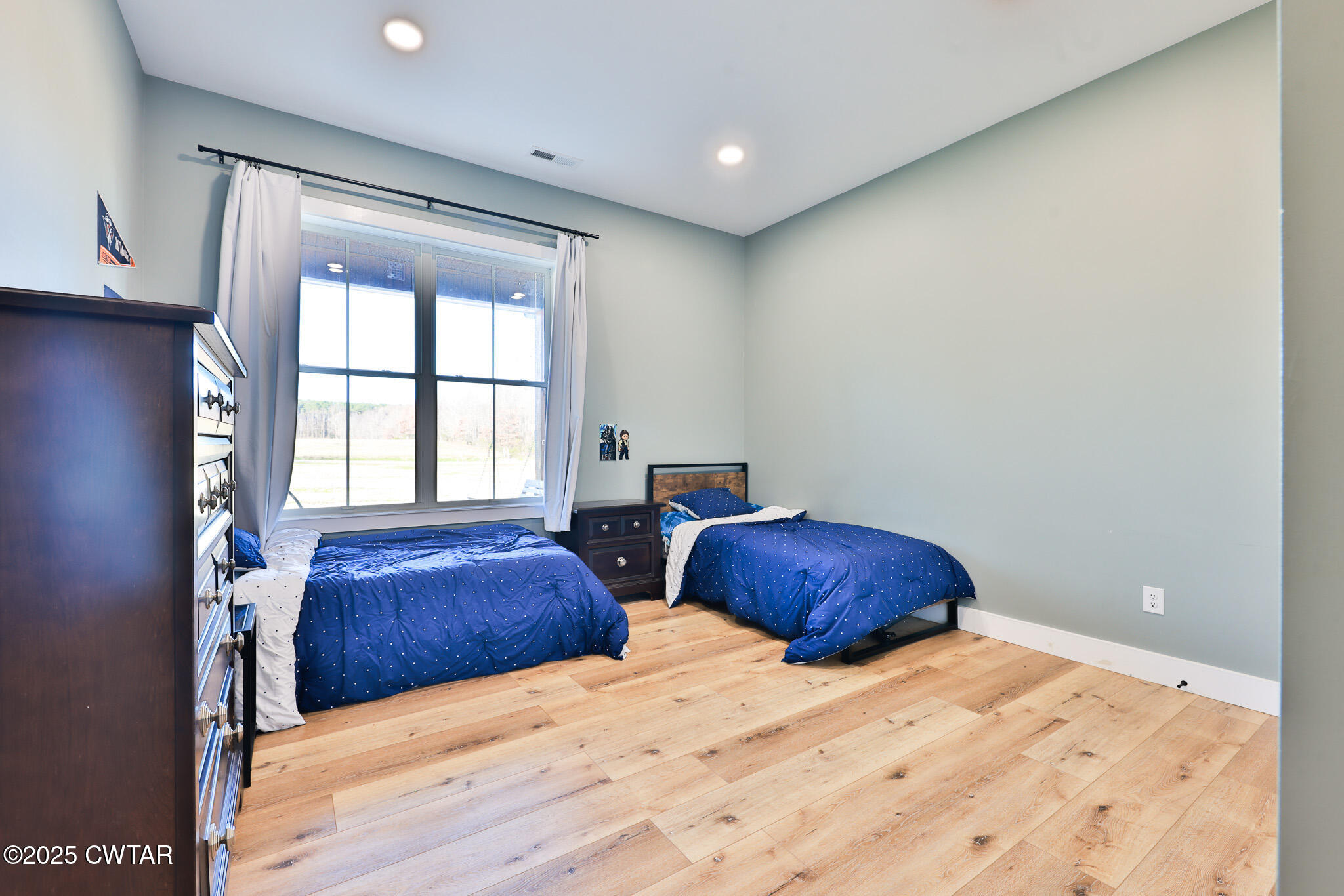 350 Klutts Road Dresden, TN 38225 - Photo 20 of 39 a bedroom with two beds and a large window