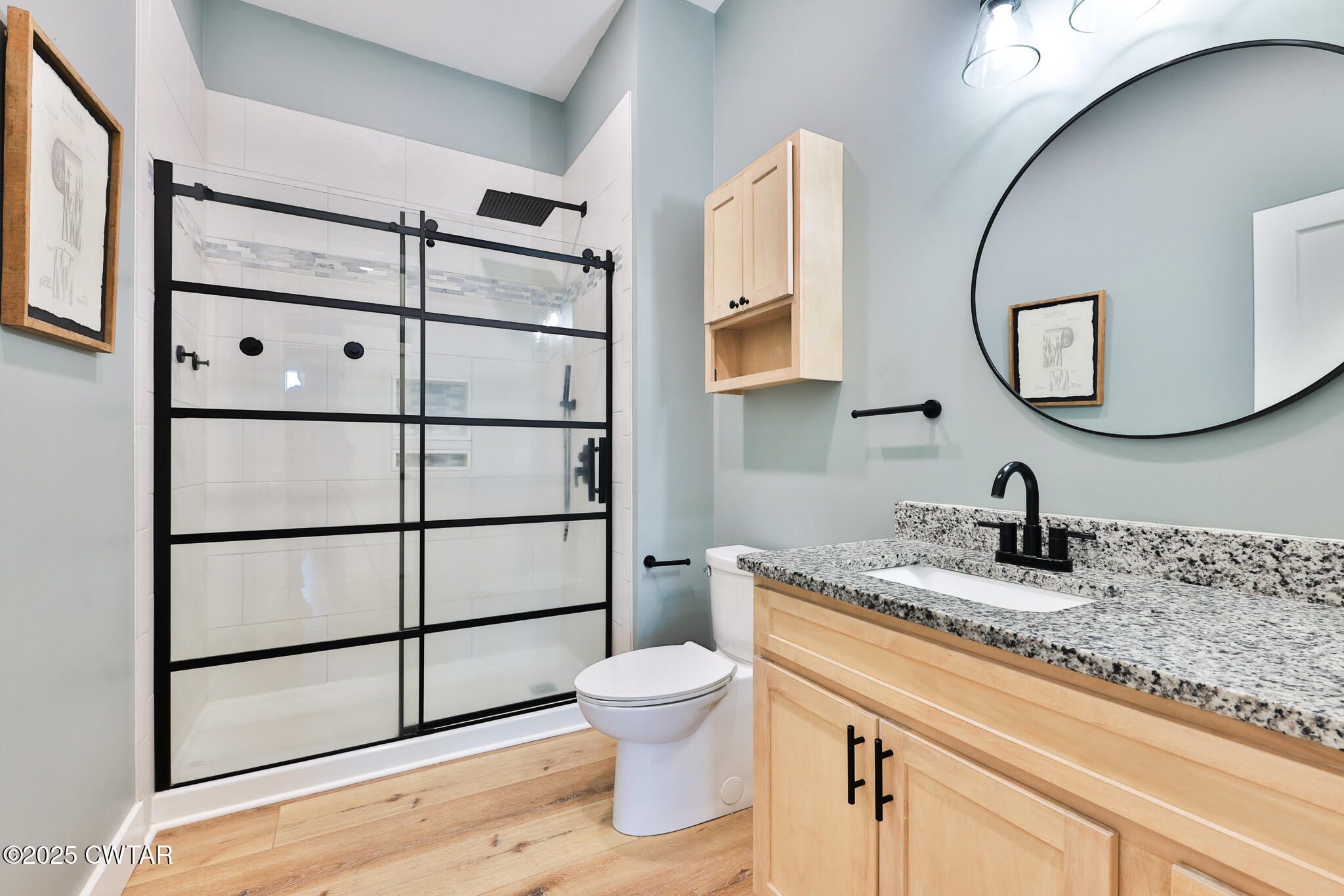 350 Klutts Road Dresden, TN 38225 - Photo 24 of 39 a bathroom with a granite countertop toilet sink and mirror