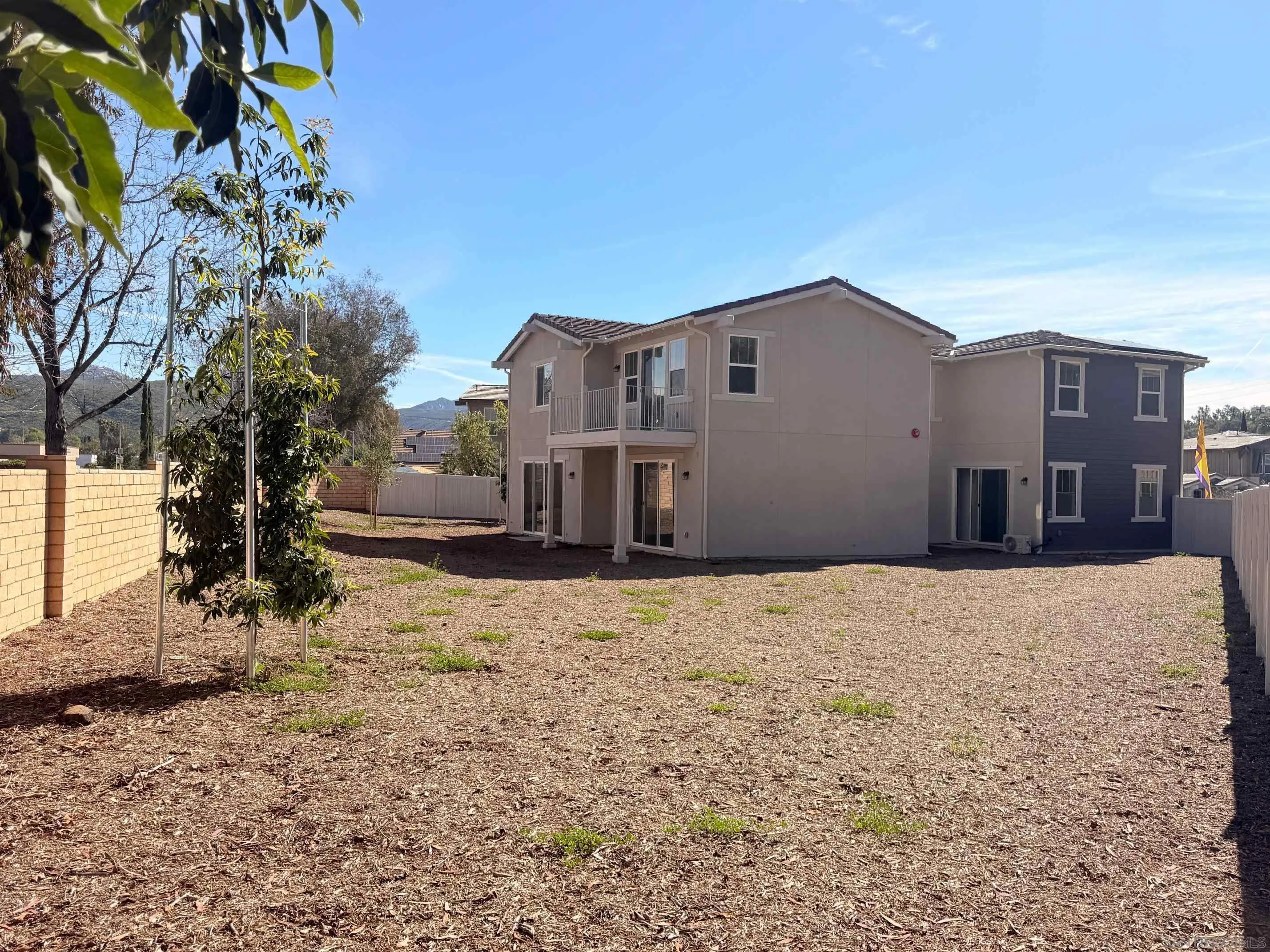 13780 Holly Oak Way Poway, CA 92064 - Photo 4 of 10 a house that has a tree in front of it