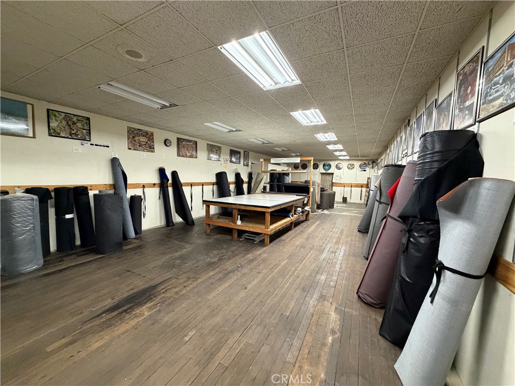 247 South Riverside Avenue Rialto, CA 92376 - Photo 14 of 34 a living room with lots of furniture and a wooden floor