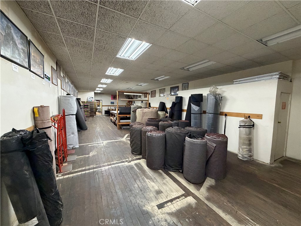 247 South Riverside Avenue Rialto, CA 92376 - Photo 15 of 34 a living room with lots of furniture and a refrigerator