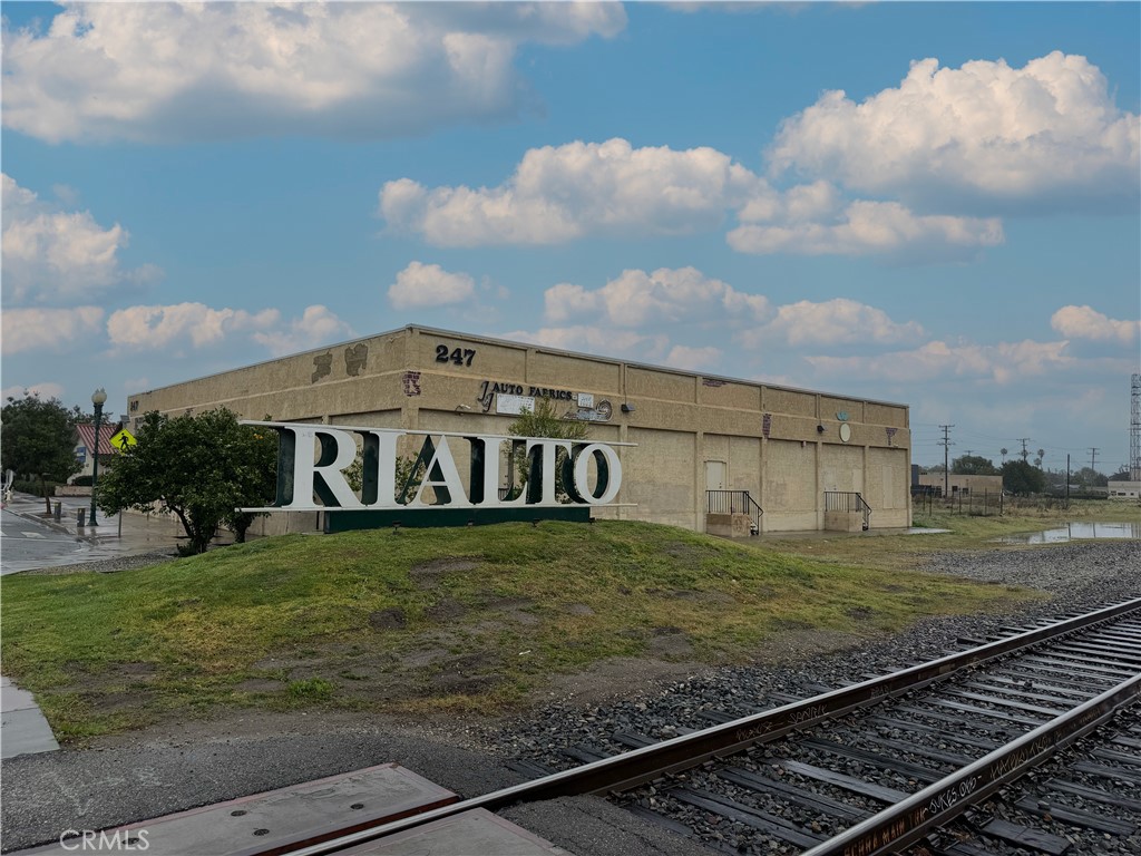247 South Riverside Avenue Rialto, CA 92376 - Photo 2 of 34 a view of a yard with an house
