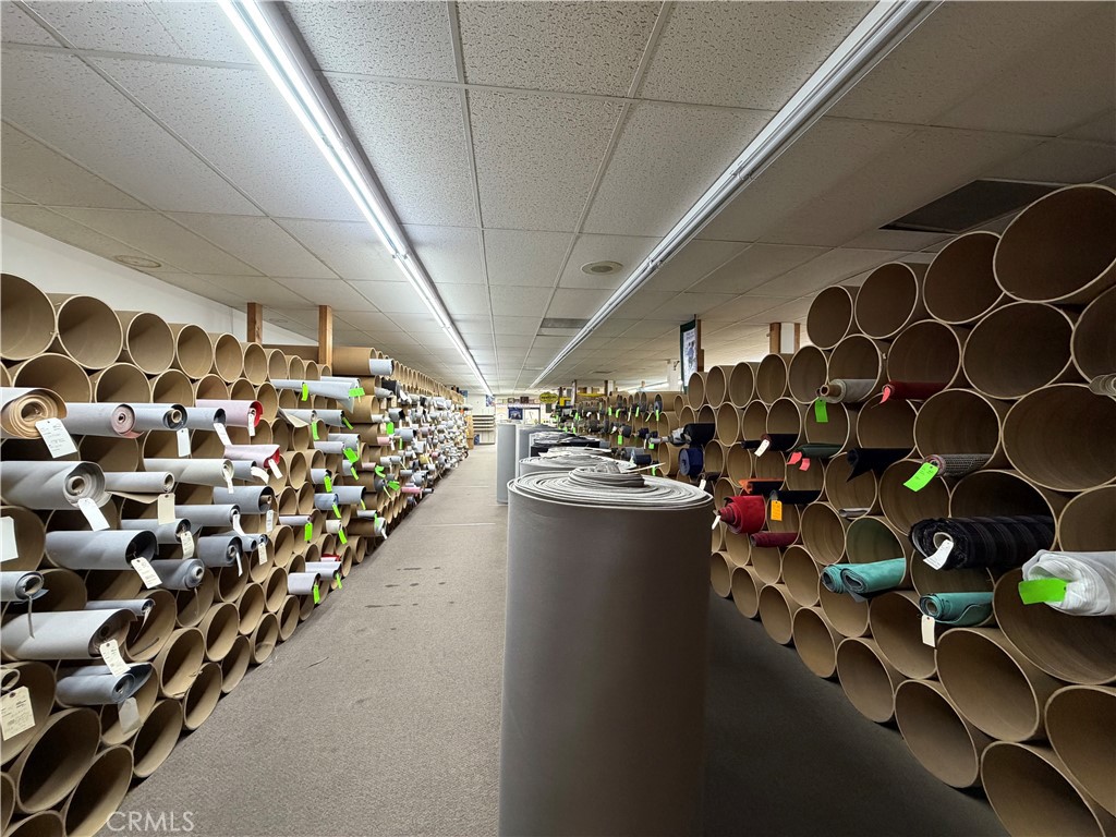 247 South Riverside Avenue Rialto, CA 92376 - Photo 6 of 34 a room with lots of different colored cloths