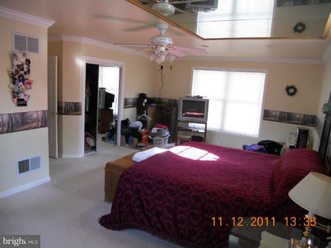 4101 Roop Road Mount Airy, MD 21771 - Photo 11 of 28 a bedroom with a bed and window