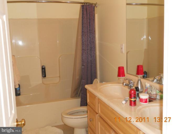 4101 Roop Road Mount Airy, MD 21771 - Photo 24 of 28 a bathroom with a sink and a mirror