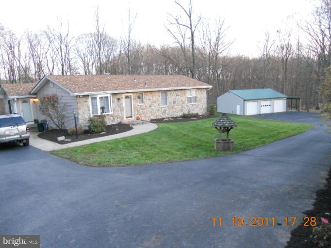 4101 Roop Road Mount Airy, MD 21771 - Photo 27 of 28 a front view of a house with a yard and garage