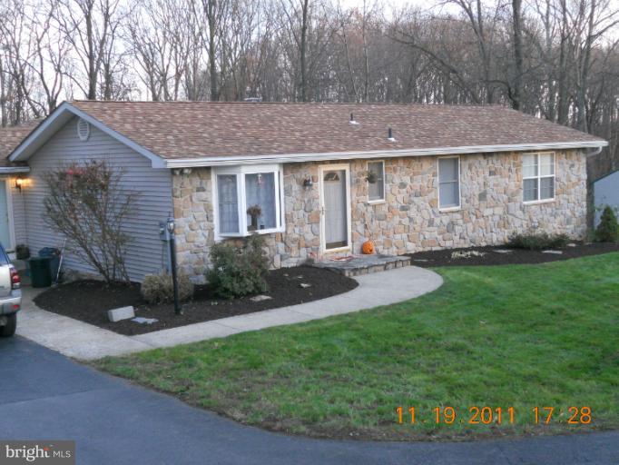 4101 Roop Road Mount Airy, MD 21771 - Photo 28 of 28 a view of a house with a yard and sitting area