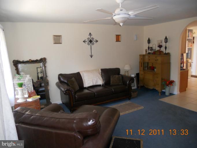 4101 Roop Road Mount Airy, MD 21771 - Photo 5 of 28 a living room with furniture and a flat screen tv
