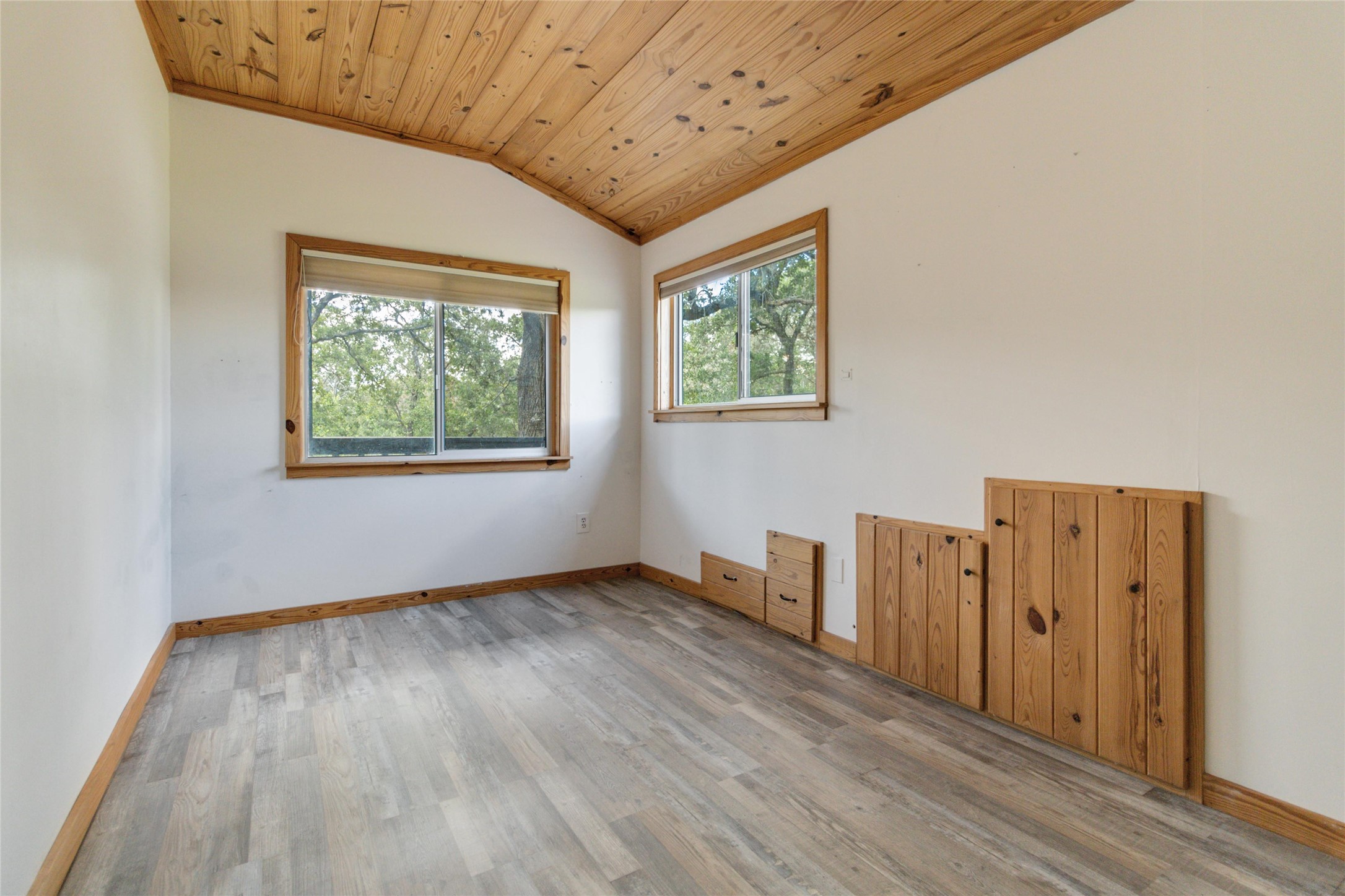 180 Ironstone Road Smithville, TX 78957 - Photo 20 of 37 Unfurnished room with a vaulted wood ceiling and light wood-style floors