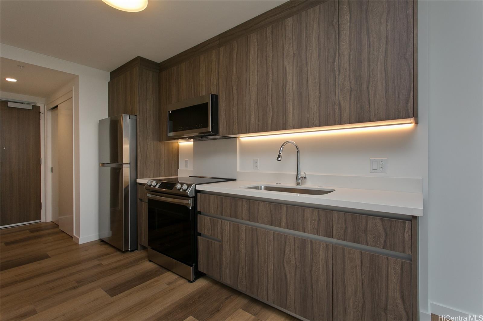 a kitchen with a sink stainless steel appliances and cabinets