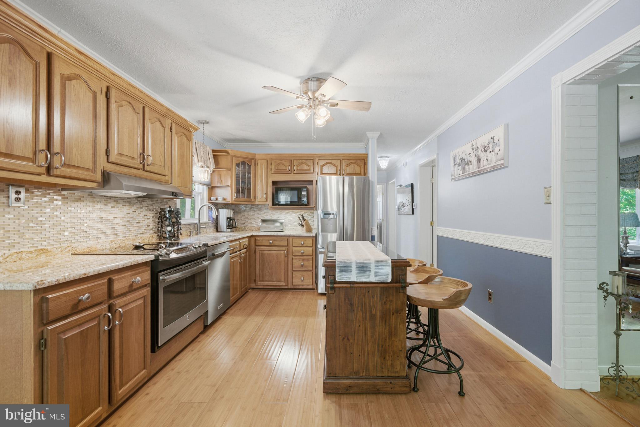 100 David Gray Road St. Leonard, MD 20685 - Photo 15 of 61 Large island with seating and storage.