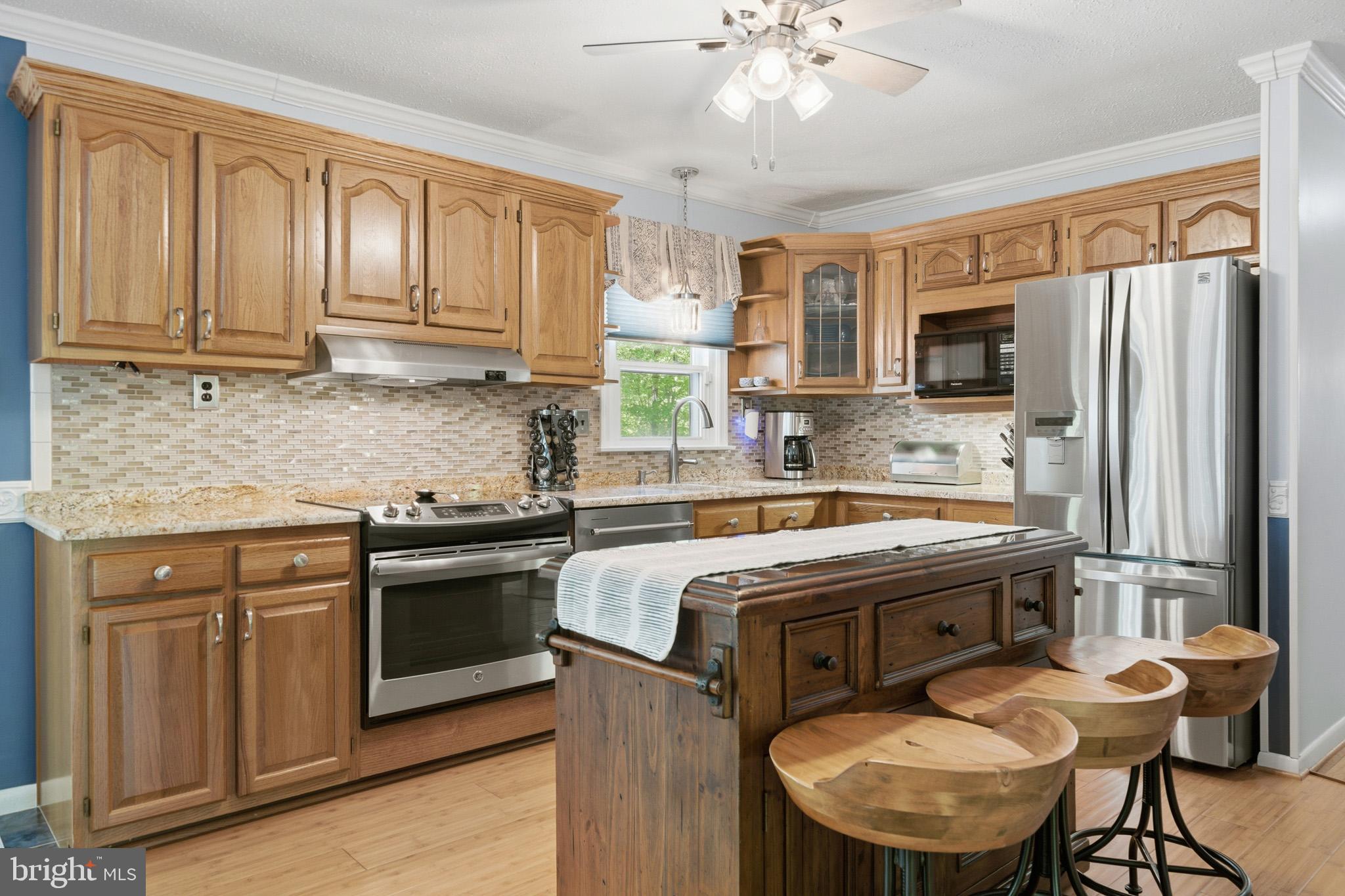100 David Gray Road St. Leonard, MD 20685 - Photo 17 of 61 Stainless appliances set off the space.