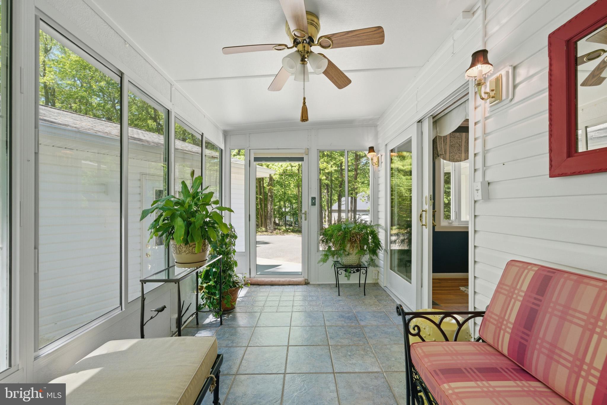 100 David Gray Road St. Leonard, MD 20685 - Photo 22 of 61 Stunning enclosed patio for year long views.