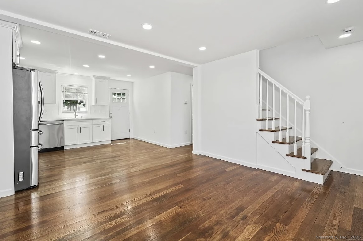 405 Ruth Street Bridgeport, CT 06606 - Photo 6 of 17 a view of a kitchen with a sink and a refrigerator