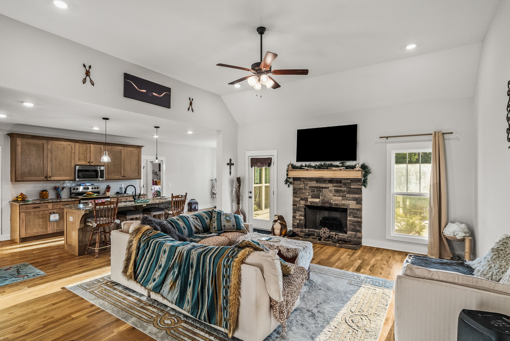 3378 New Hall Road Greenbrier, TN 37073 - Photo 20 of 83 a living room with fireplace furniture and a flat screen tv