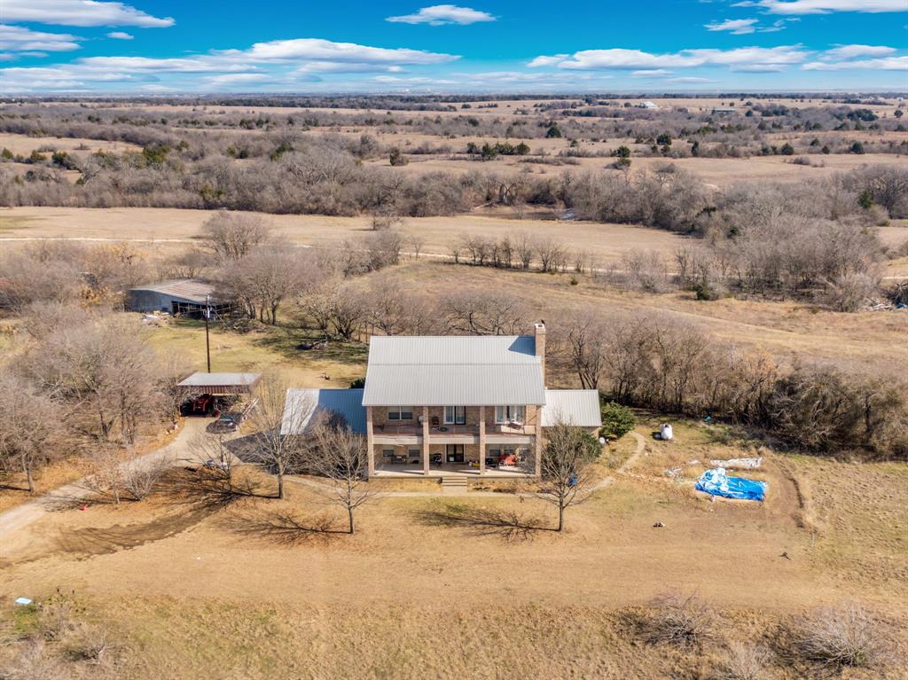 10400 Baucum Road Midlothian, TX 76065 - Photo 1 of 17 a view of a building with wooden floor