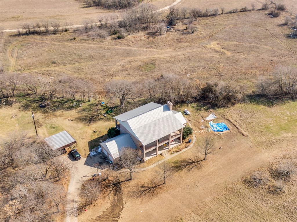 10400 Baucum Road Midlothian, TX 76065 - Photo 4 of 17 an aerial view of a house with a yard and ocean view