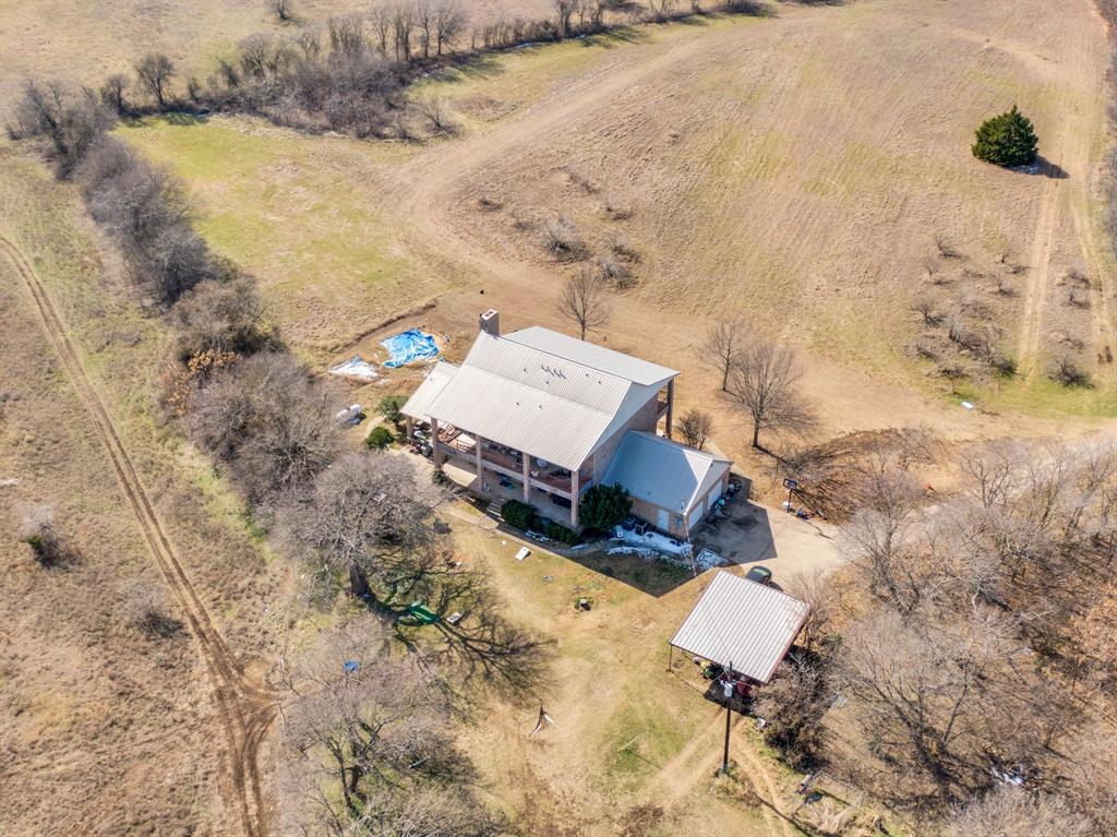 10400 Baucum Road Midlothian, TX 76065 - Photo 7 of 17 an aerial view of a house with a yard and lake view