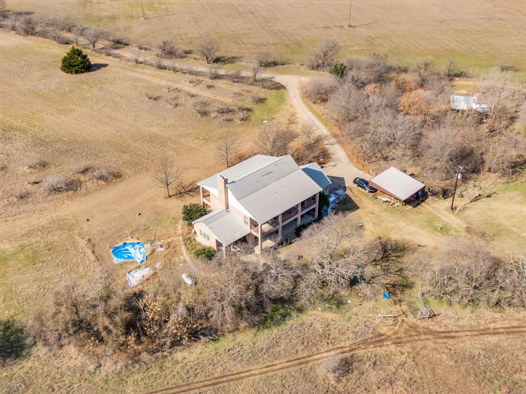 10400 Baucum Road Midlothian, TX 76065 - Photo 8 of 17 an aerial view of a house with a yard