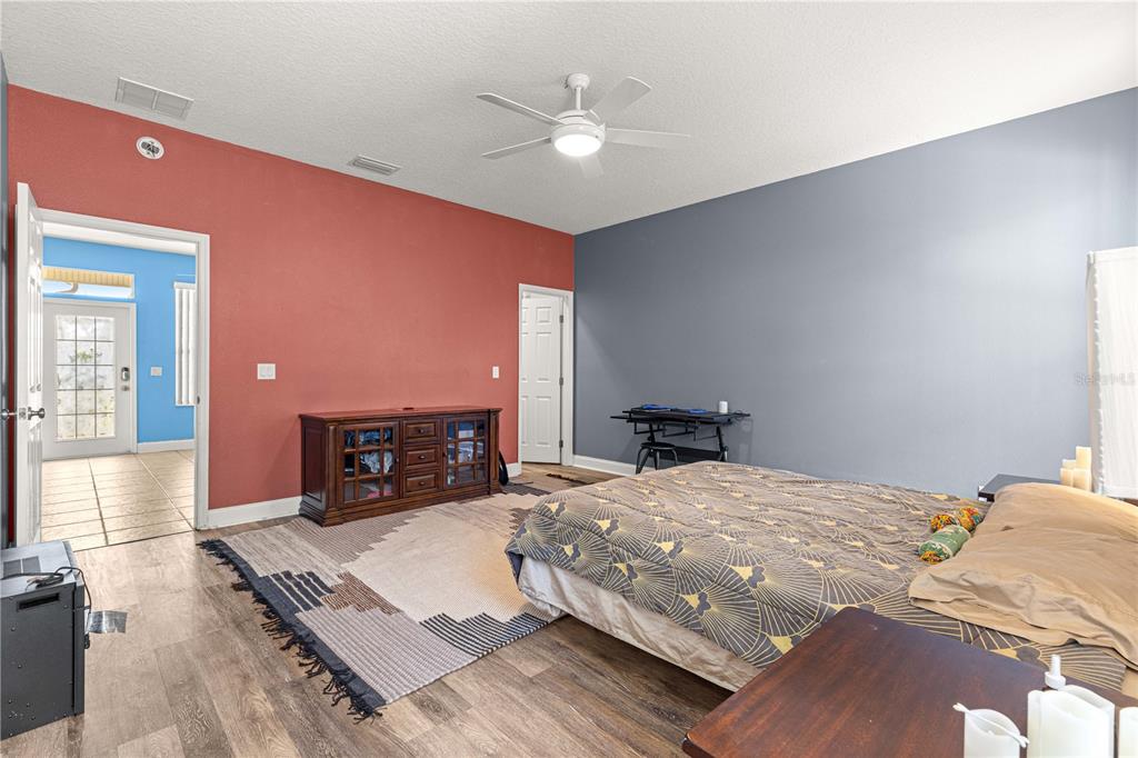 6551 Southeast 11th Loop Ocala, FL 34472 - Photo 19 of 46 a bed room with a bed window and a television