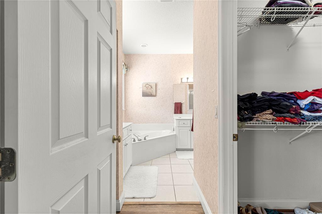 6551 Southeast 11th Loop Ocala, FL 34472 - Photo 21 of 46 a bathroom with a tub and shower