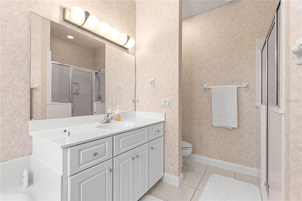 6551 Southeast 11th Loop Ocala, FL 34472 - Photo 23 of 46 a bathroom with a sink a toilet and vanity