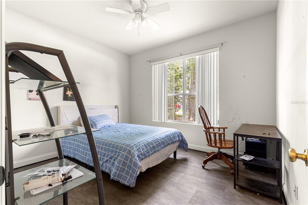 6551 Southeast 11th Loop Ocala, FL 34472 - Photo 25 of 46 a bedroom with a bed and a window