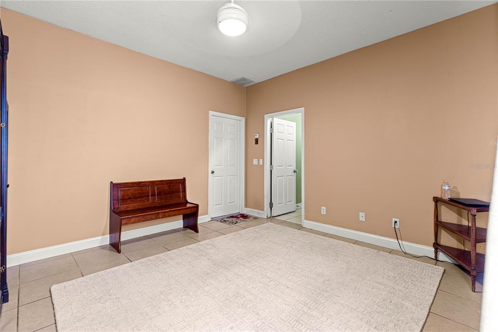 6551 Southeast 11th Loop Ocala, FL 34472 - Photo 32 of 46 a view of a room with furniture and wooden floor