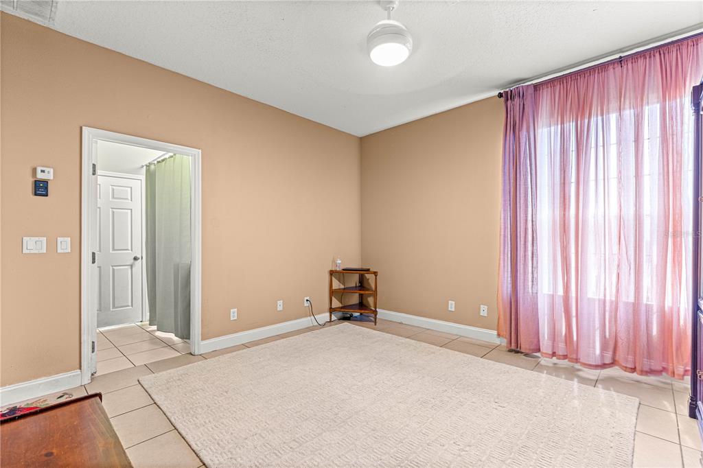 6551 Southeast 11th Loop Ocala, FL 34472 - Photo 33 of 46 wooden floor and window in a room