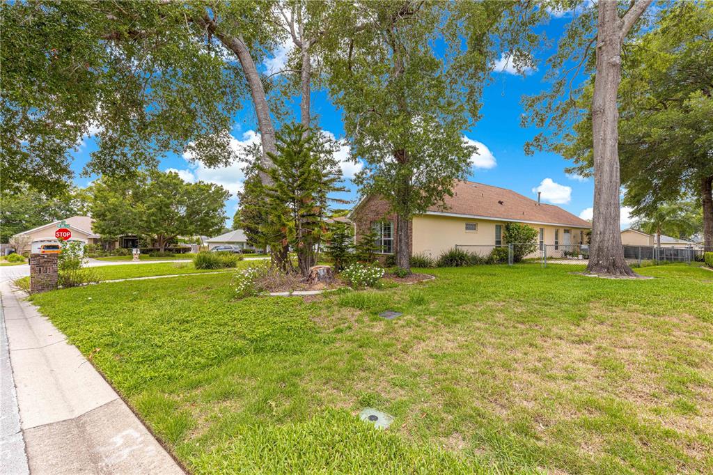 6551 Southeast 11th Loop Ocala, FL 34472 - Photo 40 of 46 a front view of a house with garden