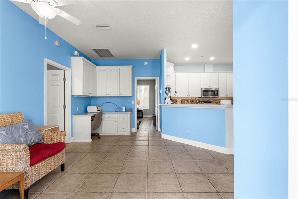 6551 Southeast 11th Loop Ocala, FL 34472 - Photo 8 of 46 a kitchen with stainless steel appliances granite countertop a refrigerator and a stove