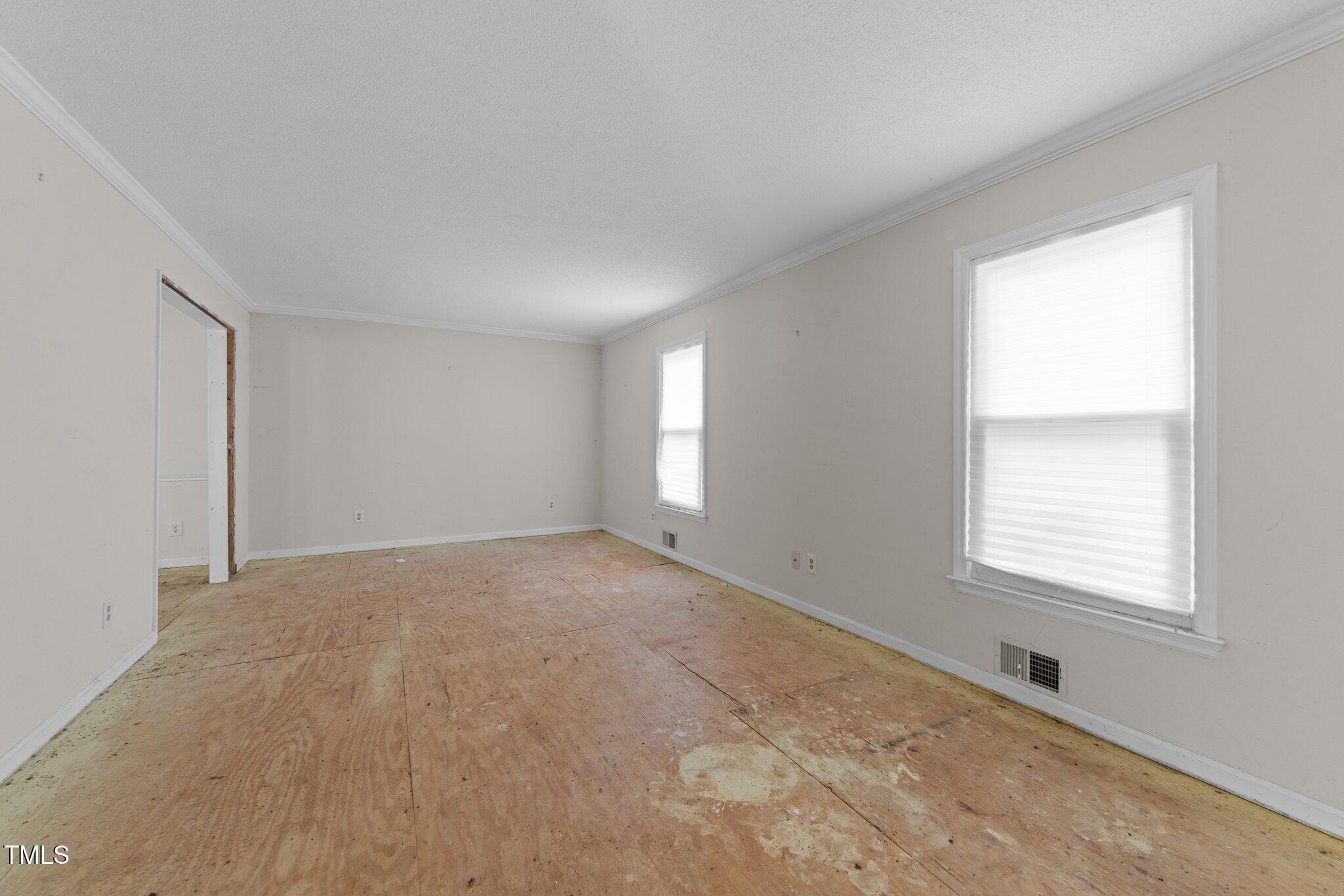 204 Chatterson Drive Raleigh, NC 27615 - Photo 7 of 40 a view of an empty room with a window