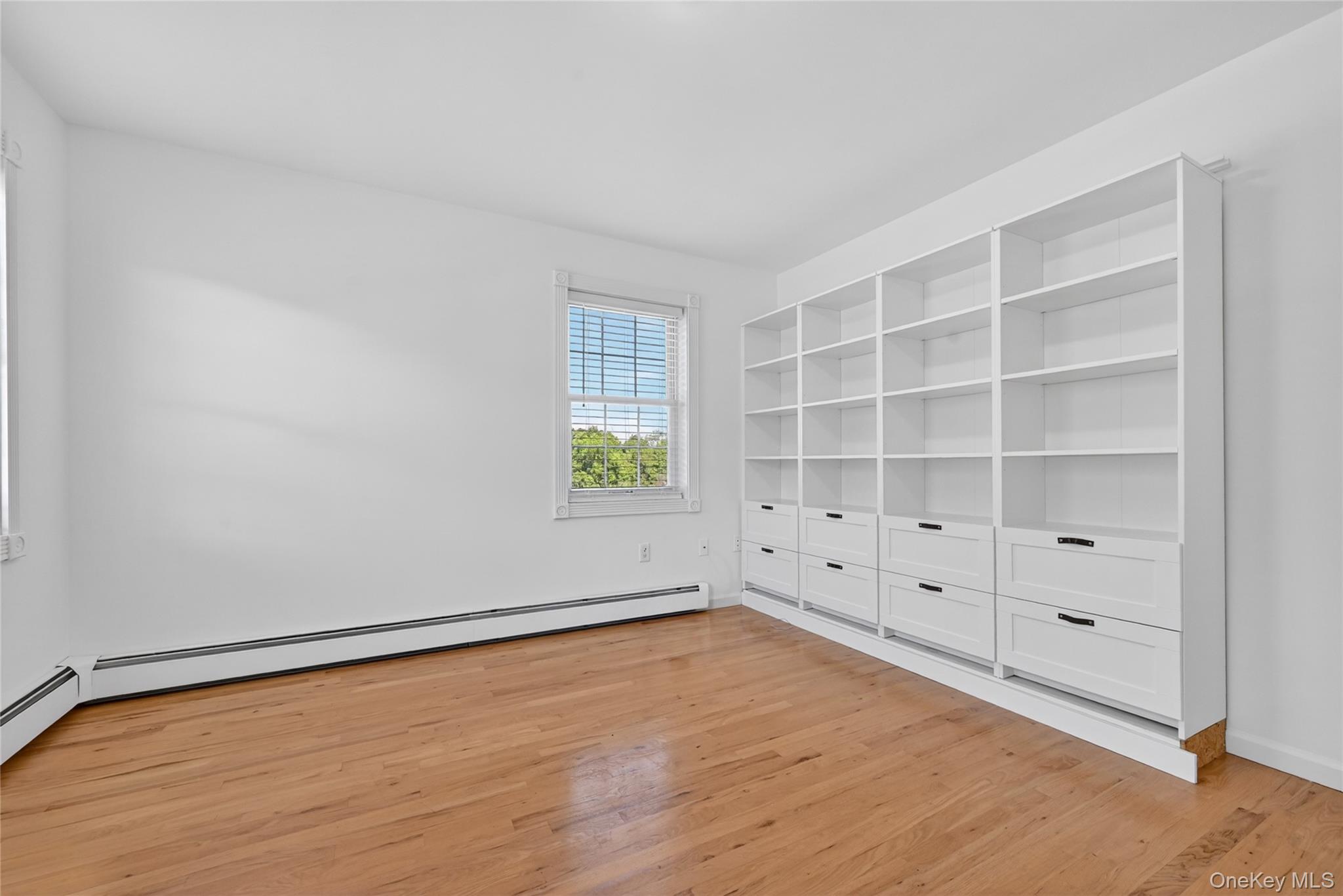 954 Ridgebury Road New Hampton, NY 10958 - Photo 37 of 45 Built-in shelving and drawers add function and charm to this versatile flex room, creating a practical place for work, hobbies, storage, or creative projects.