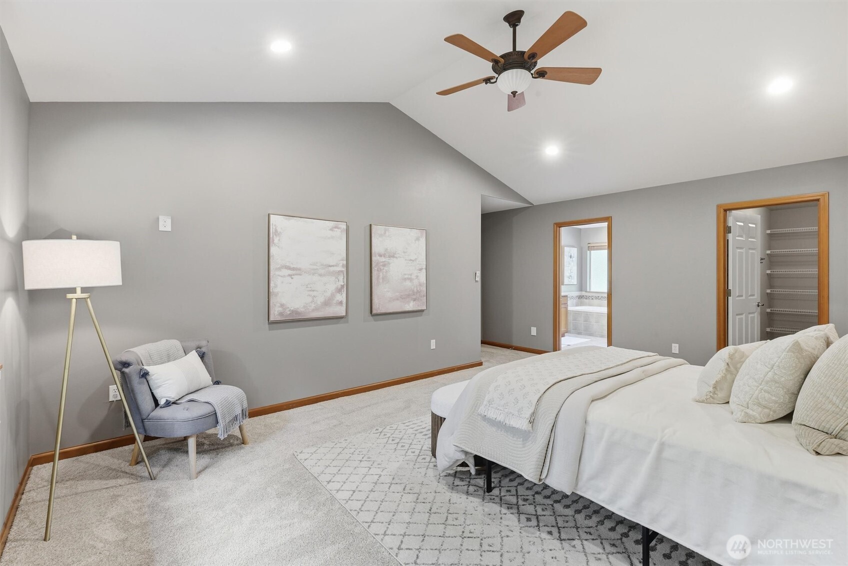 4202 Silvana Terrace Road Stanwood, WA 98292 - Photo 30 of 40 a bedroom with a bed and a chandelier