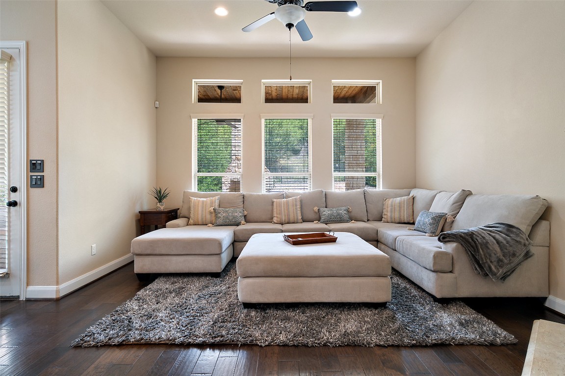 209 Maxwell Way Austin, TX 78738 - Photo 11 of 32 a living room with furniture and a window