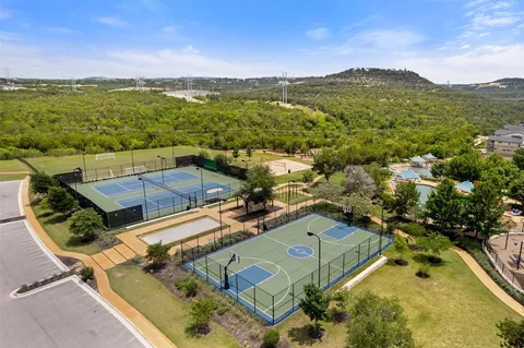 an aerial view of residential houses with outdoor space