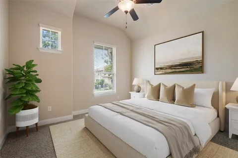 a bedroom with a bed and a potted plant