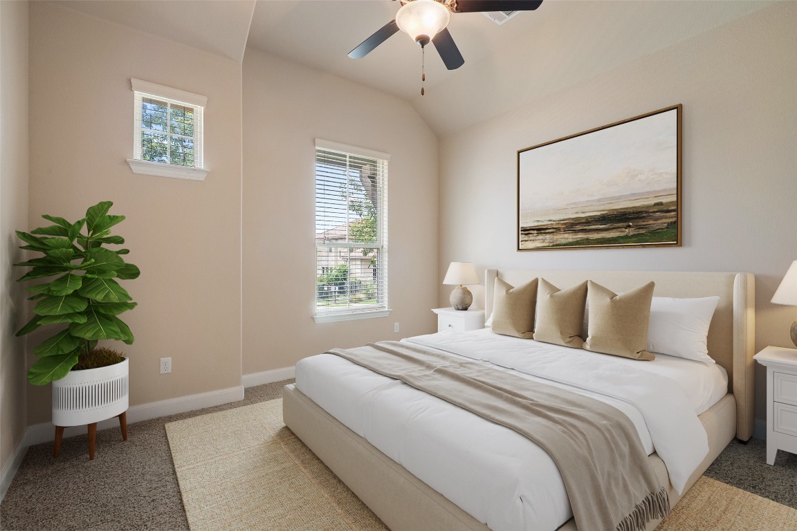 209 Maxwell Way Austin, TX 78738 - Photo 21 of 32 a bedroom with a bed and a potted plant