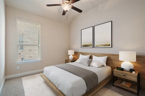 a bedroom with a bed and a tv