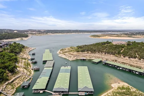 an aerial view of a house with yard swimming pool and mountain view