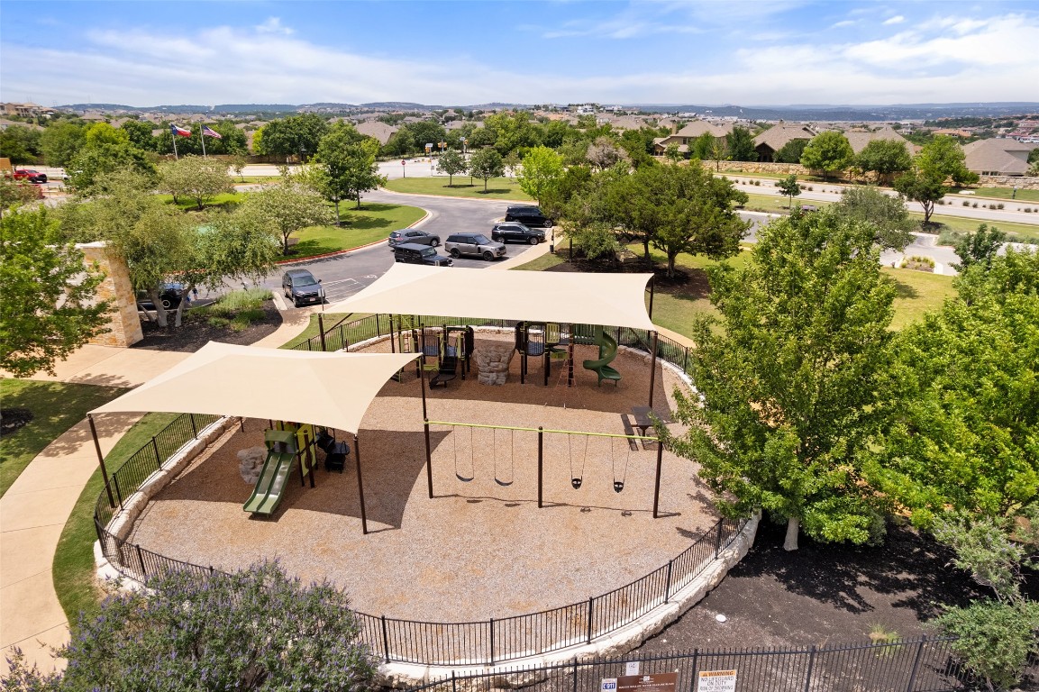 209 Maxwell Way Austin, TX 78738 - Photo 30 of 32 an aerial view of a house with yard swimming pool and mountain view