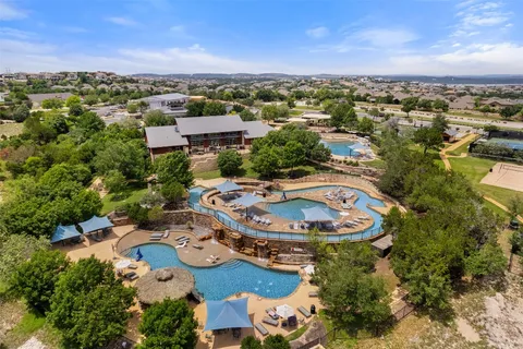 an aerial view of residential houses with outdoor space