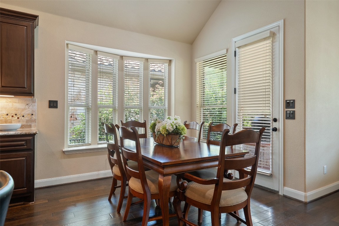 209 Maxwell Way Austin, TX 78738 - Photo 8 of 32 a view of a dining room with furniture window and wooden floor