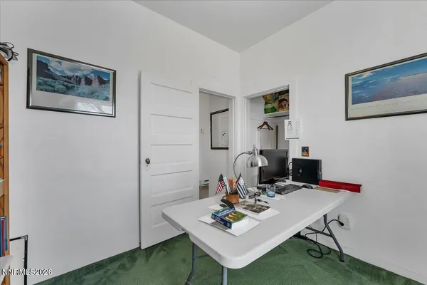 a view of a workspace with furniture