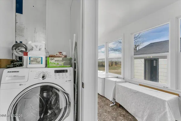 a view of livingroom with washer and dryer